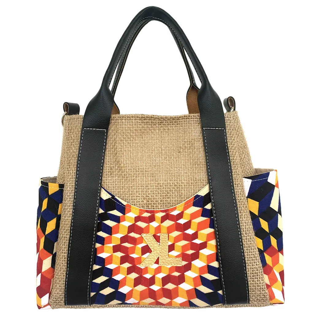 Sac à main Kalia Mini Graphik en toile de jute beige, avec poches latérales et frontale en tissu géométrique multicolore et anses en simili cuir noir.